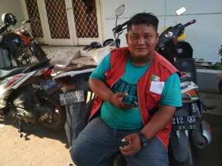 Hendri, Petugas Parkir Peserta BPJS Kesehatan.