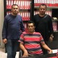 Party Pesta Simbolon (duduk) dikawal petugas Kejaksaan usai ditangkap, Rabu pagi