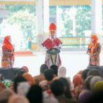 Presiden Joko Widodo saat memberikan sambutan pada Puncak Peringatan Harganas di Lapangan Merdeka, Medan, Kamis (7/7/2022)