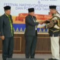 Plt Bupati Langkat, Syah Afandin menyerahkan SK kepada pengurus LASQI Langkat yang dilantik