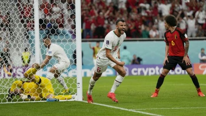 Pemain Timnas Maroko bergembira menyambut gol pertama mereka ke gawang Timnas Belgia